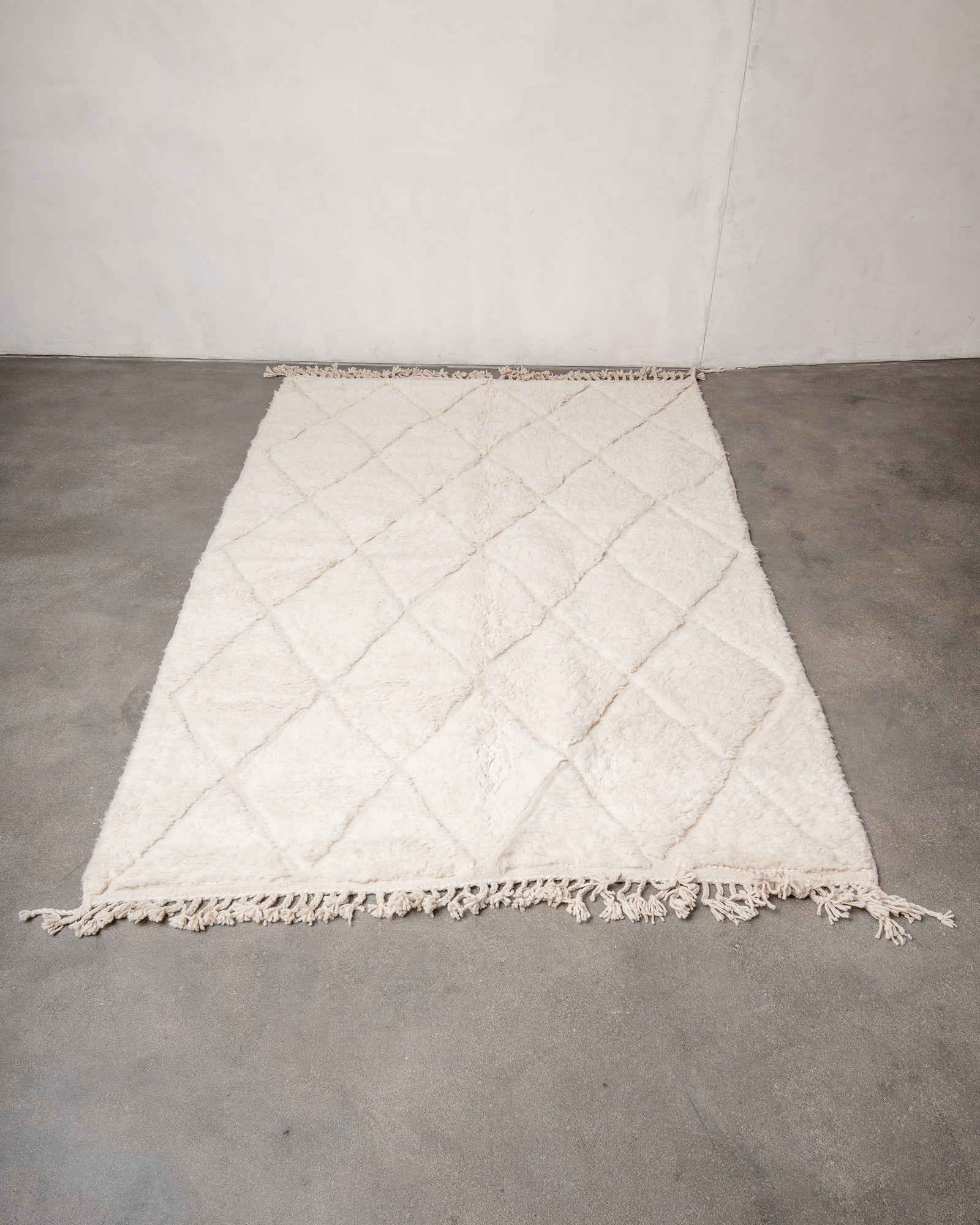 Modern, designer, handcrafted Berber rug from Morocco. Beniourain carpet with minimalist design, natural wool pile and a fluffy texture.